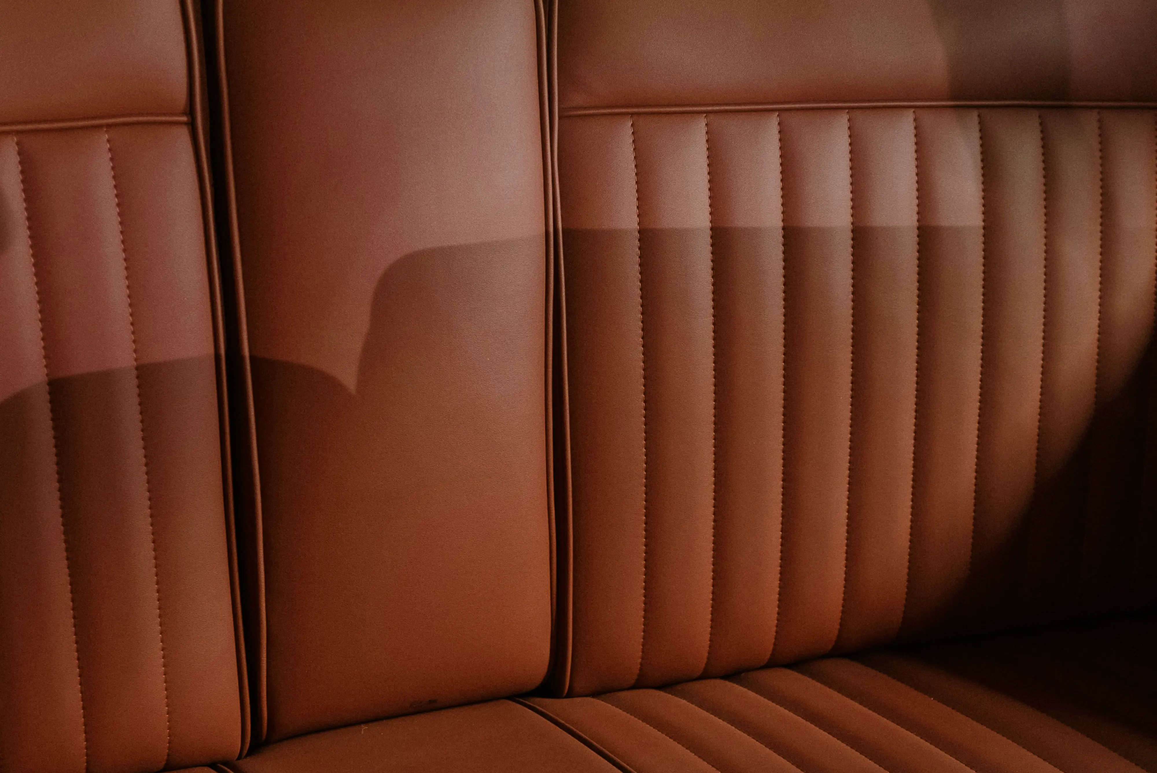 Tan leather car seat in close-up