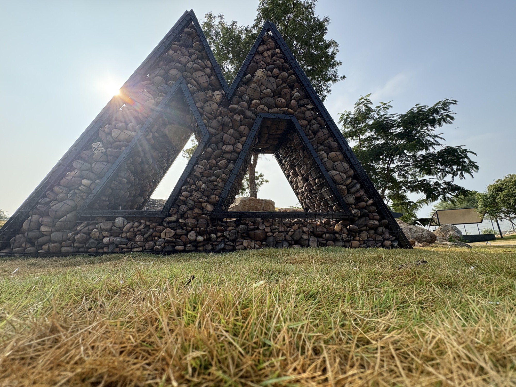 Stone-filled architectural installation at Marmeto Kridasthal in daylight