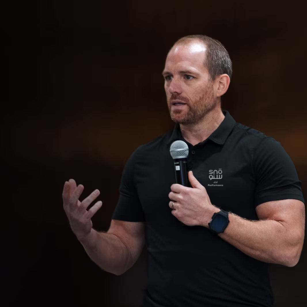 Man mid-conversation, gesturing while speaking
