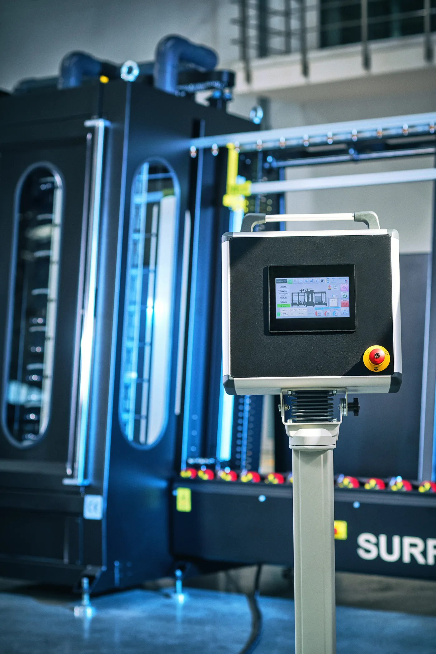 SurfaLine touch-screen control panel beside the coating machine