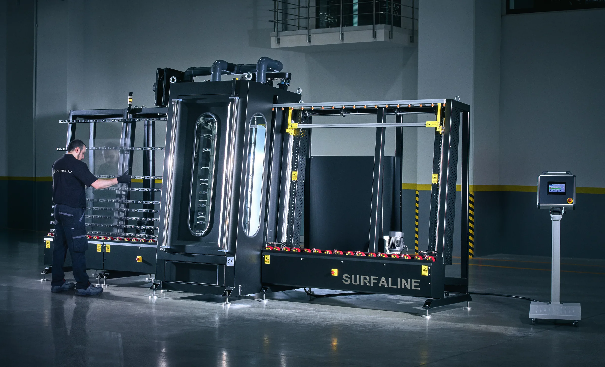 Technician working at the SurfaLine automated coating machine