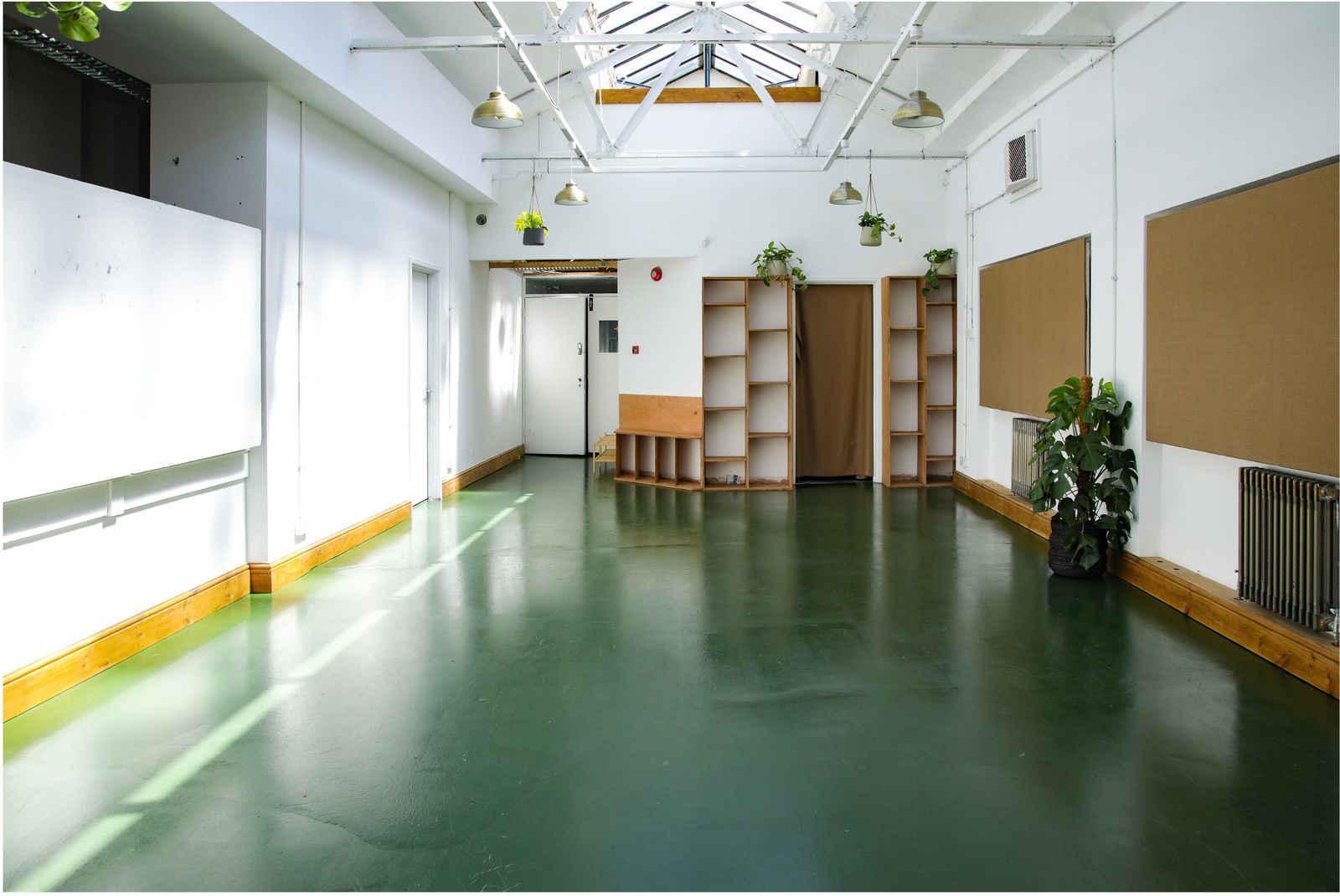 The Sunroom with its green floor and plants
