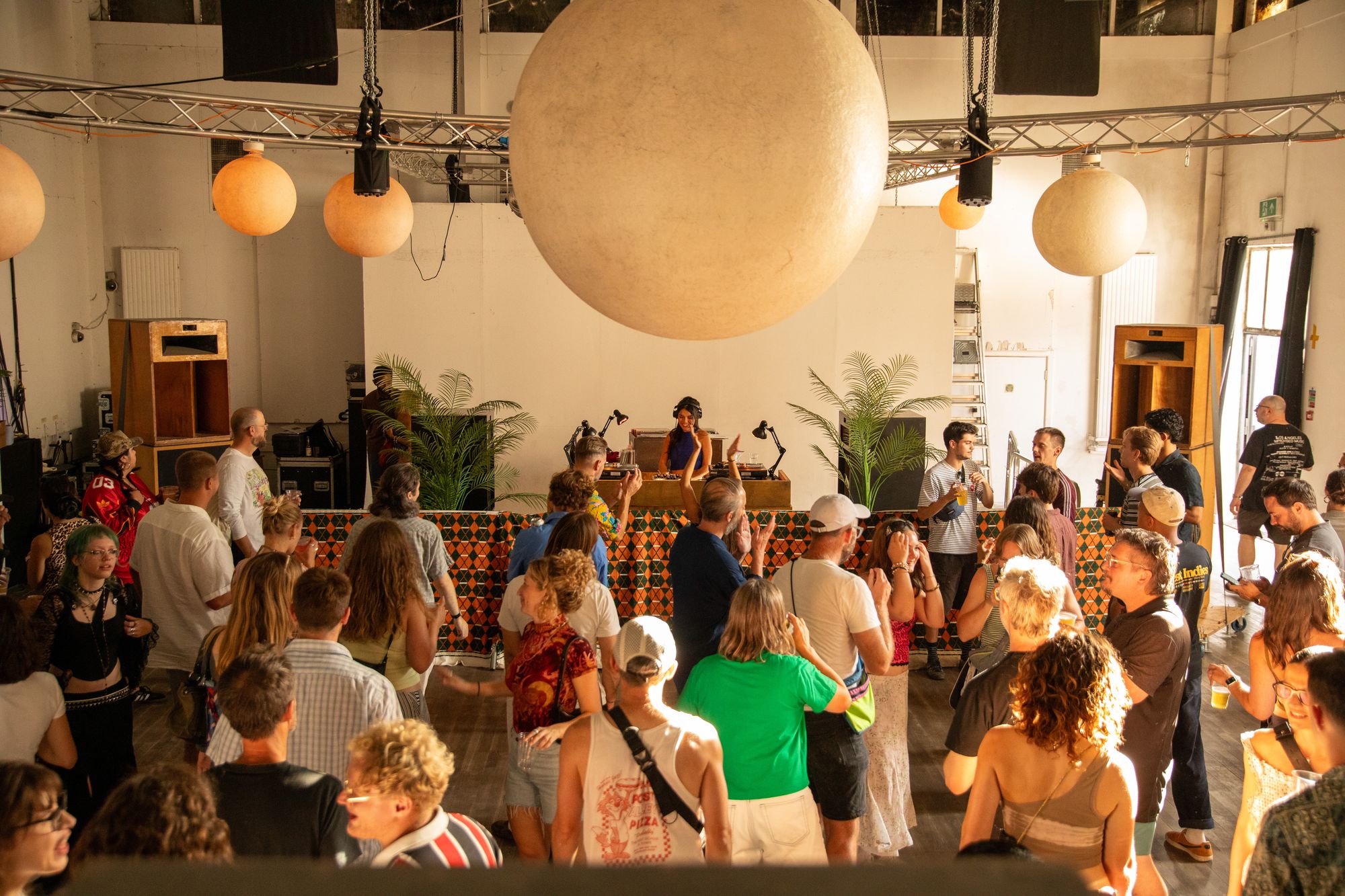 A packed Hall at Eastway Baths under paper lanterns