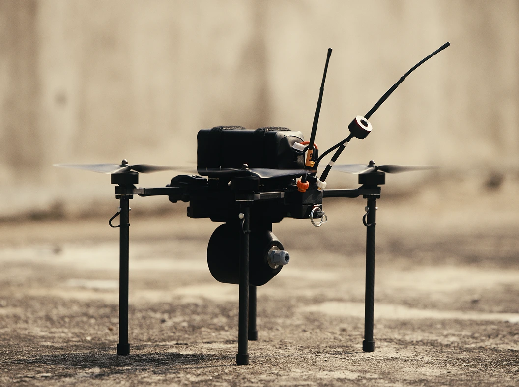 Neros Archer 8" drone on legs atop concrete.
