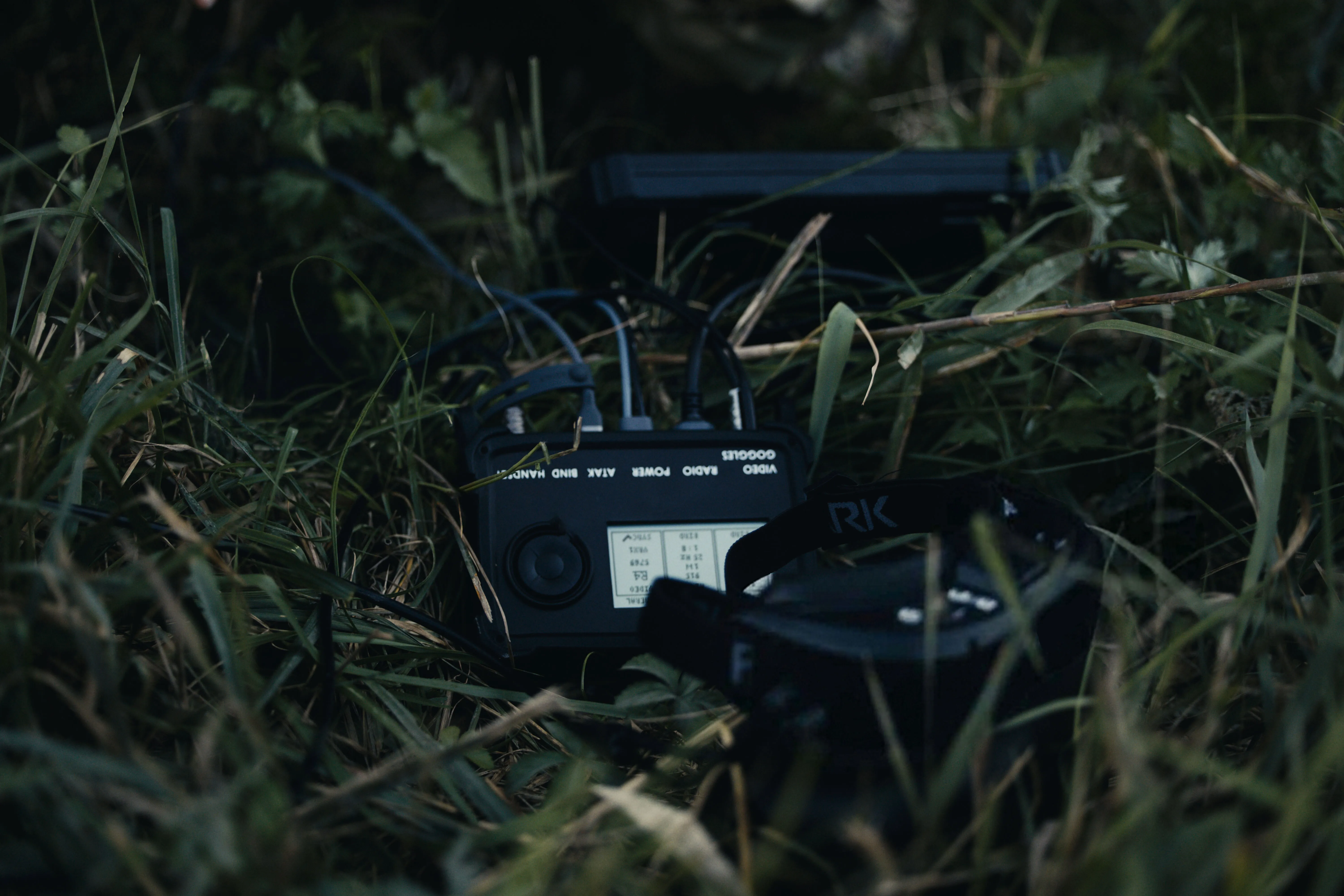 Neros Marksman handset and goggles in grassy field.