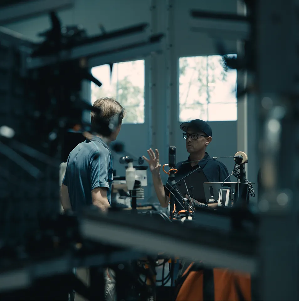 Engineers discussing in lab.