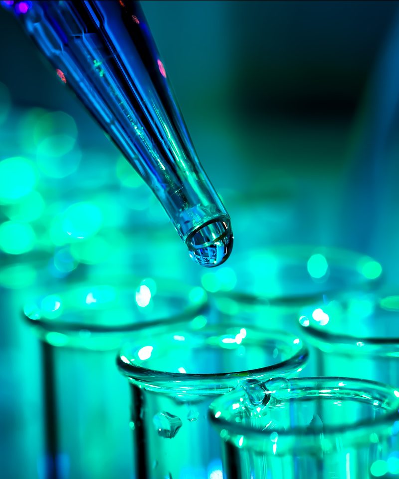 Pipette dispensing samples into laboratory beakers