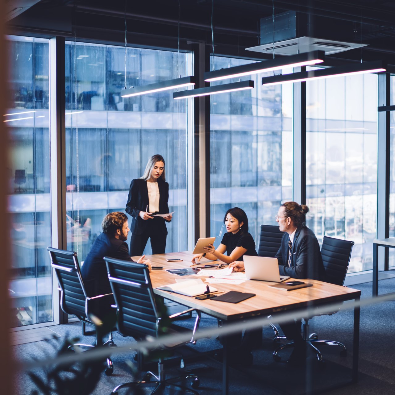 Leadership team meeting around a boardroom table