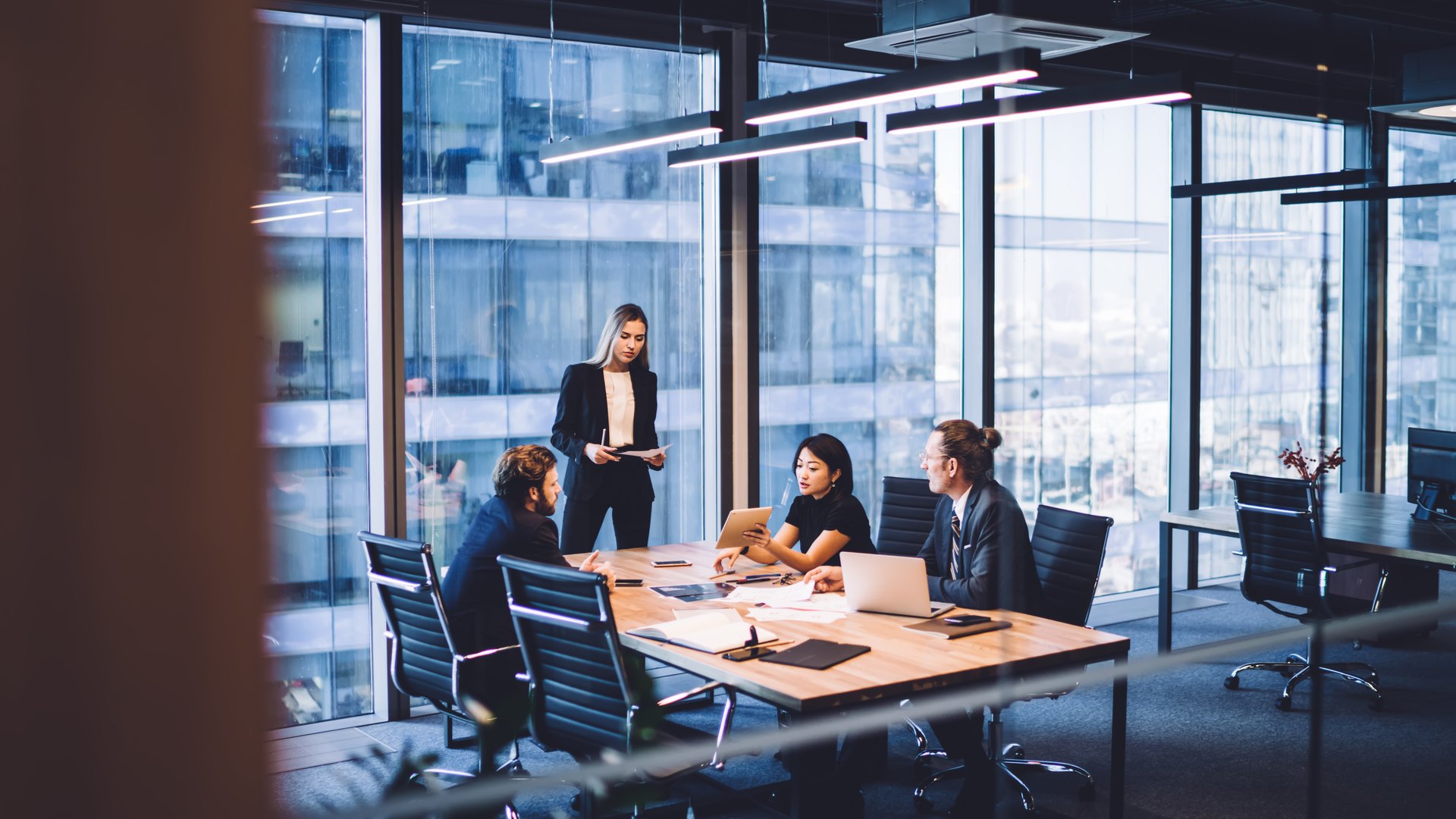 Team meeting in a glass-walled office