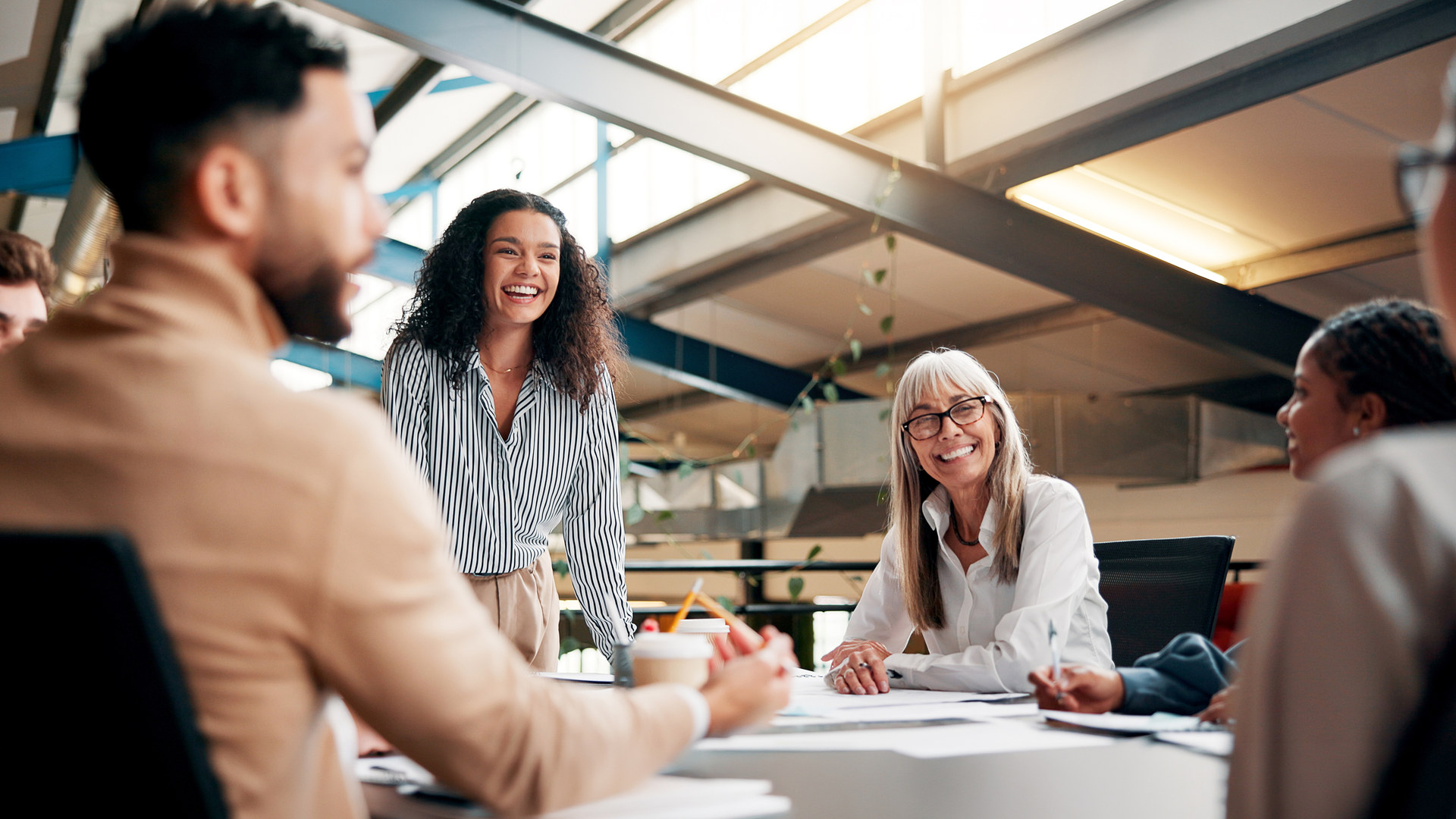 Team collaborating around a table in a bright office