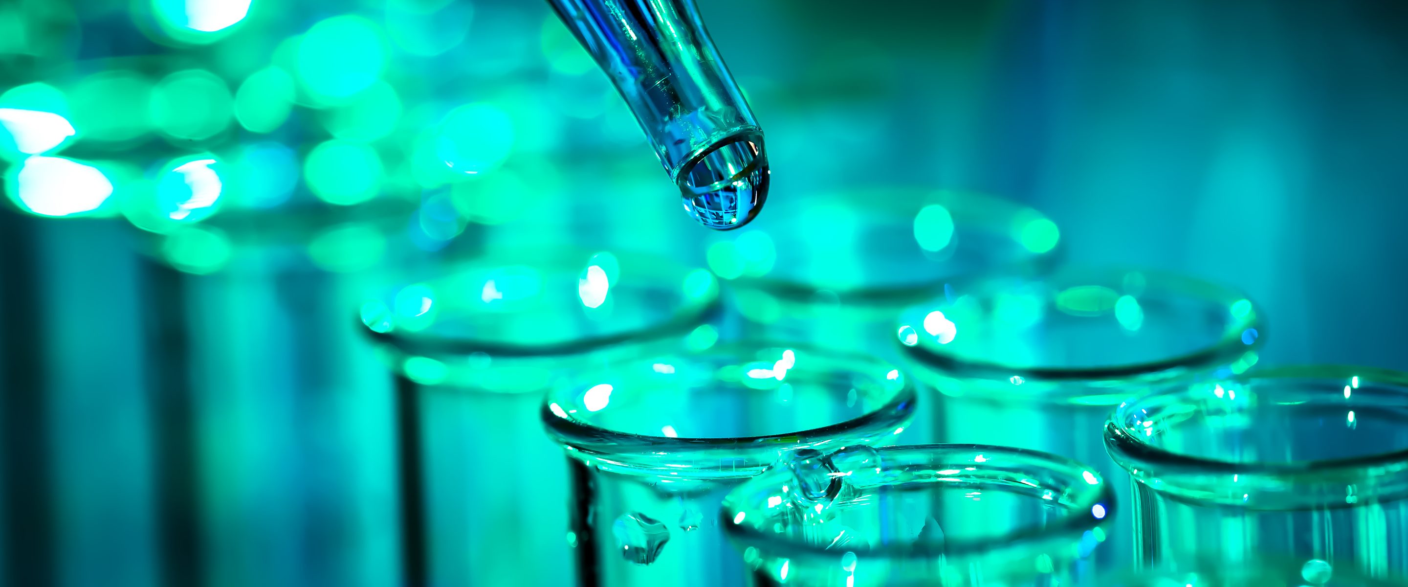 Pipette dispensing samples into laboratory beakers