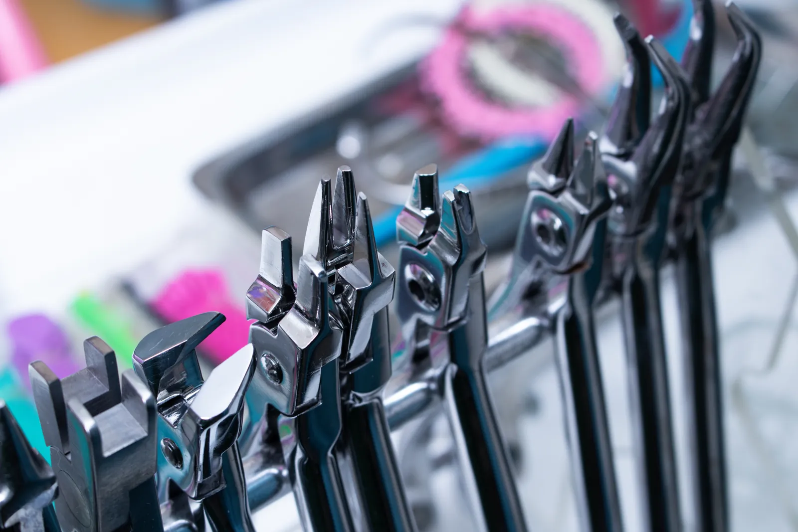 Close-up of stainless steel surgical instruments on a manufacturing line