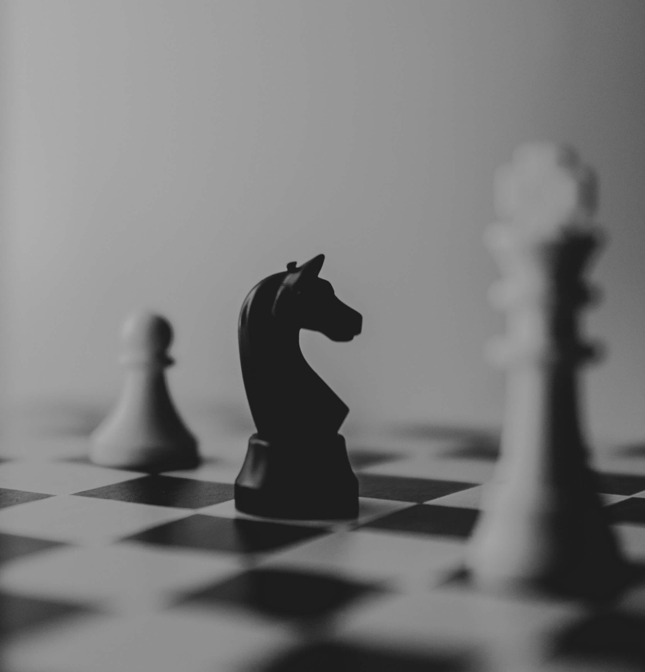 Chess pieces positioned to represent coordinated, well-run business systems