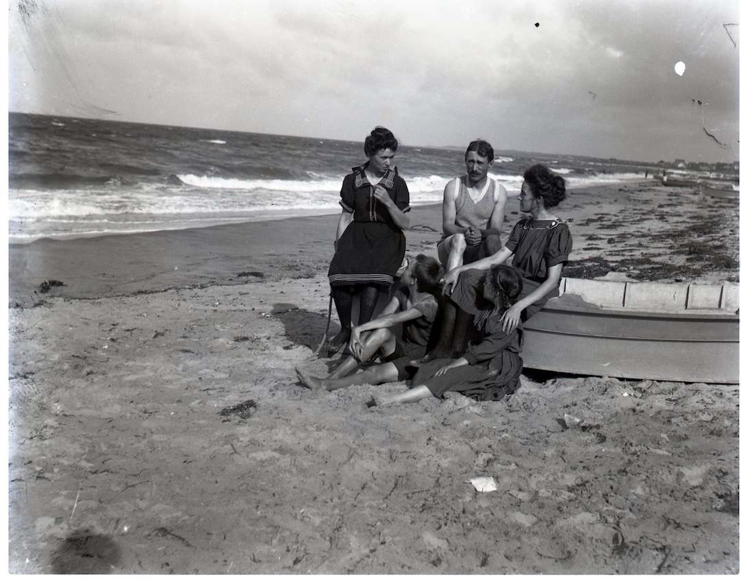 Unknown people sitting on a boat, c. 1900, glass plate negative. Gift of AEP, 2022.19.03