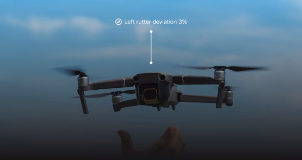 Black drone in flight over an outstretched hand against a blue sky background, showing a data label reading 'Left rutter deviation 3%'.