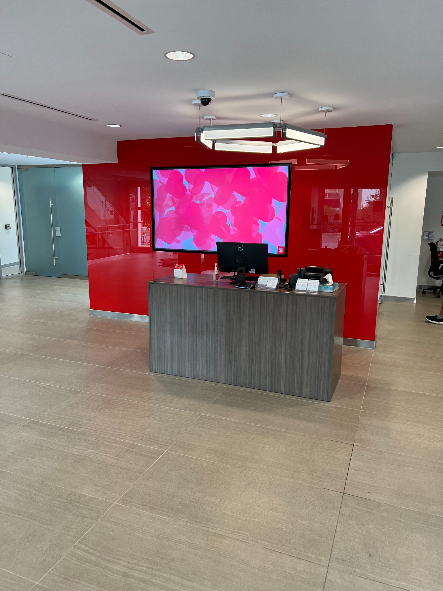 Completed Scotiabank branch reception area with red feature wall