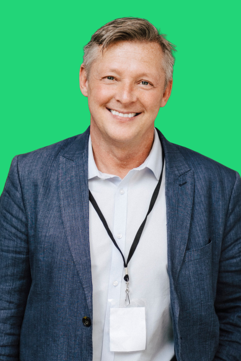 Smiling professional wearing a lanyard badge