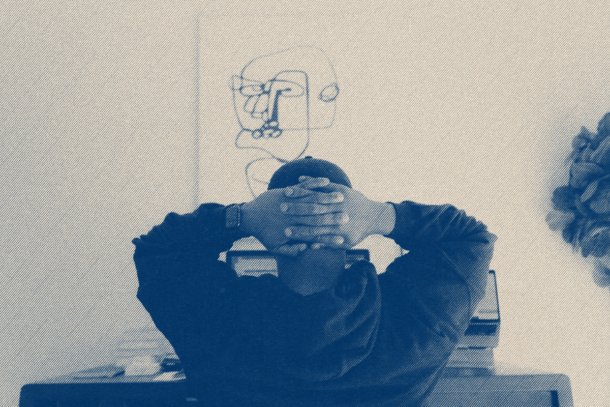 Freelancer leaning back at a desk after finishing work