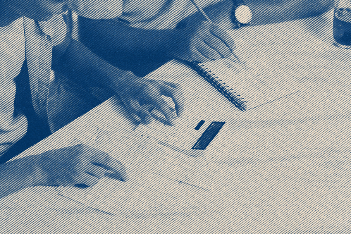Freelancer organizing papers at a bright desk