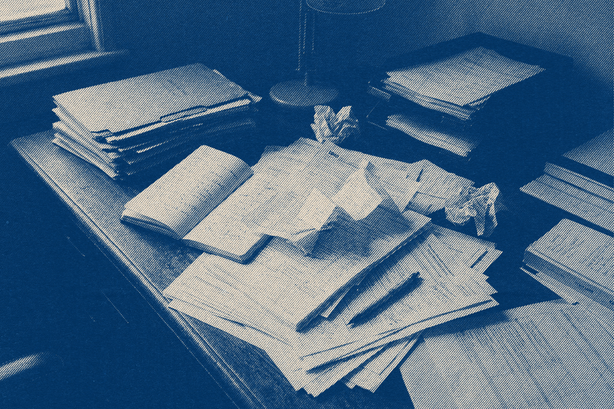 Laptop and notes during a bookkeeping cleanup