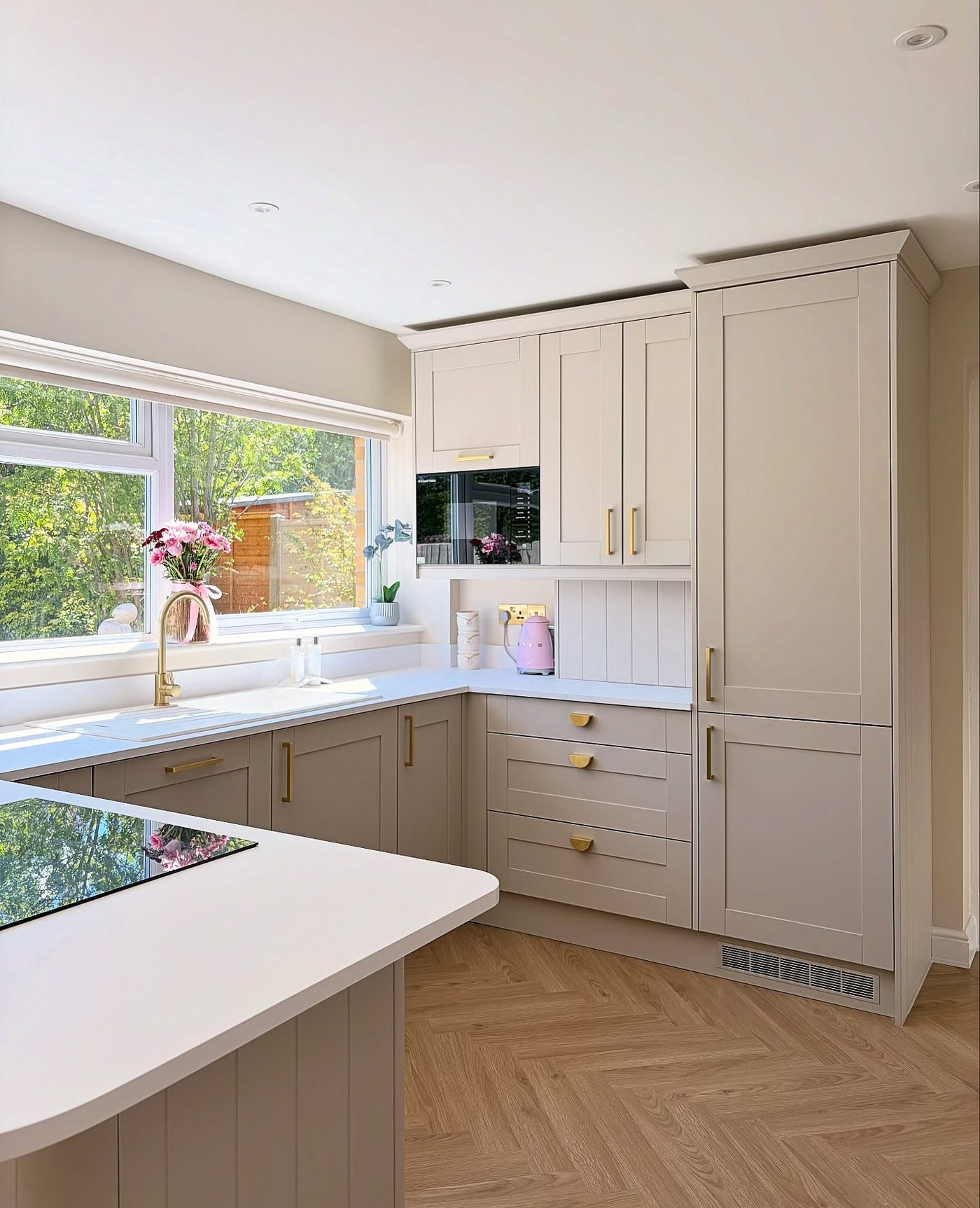 Bright kitchen remodel with herringbone floors