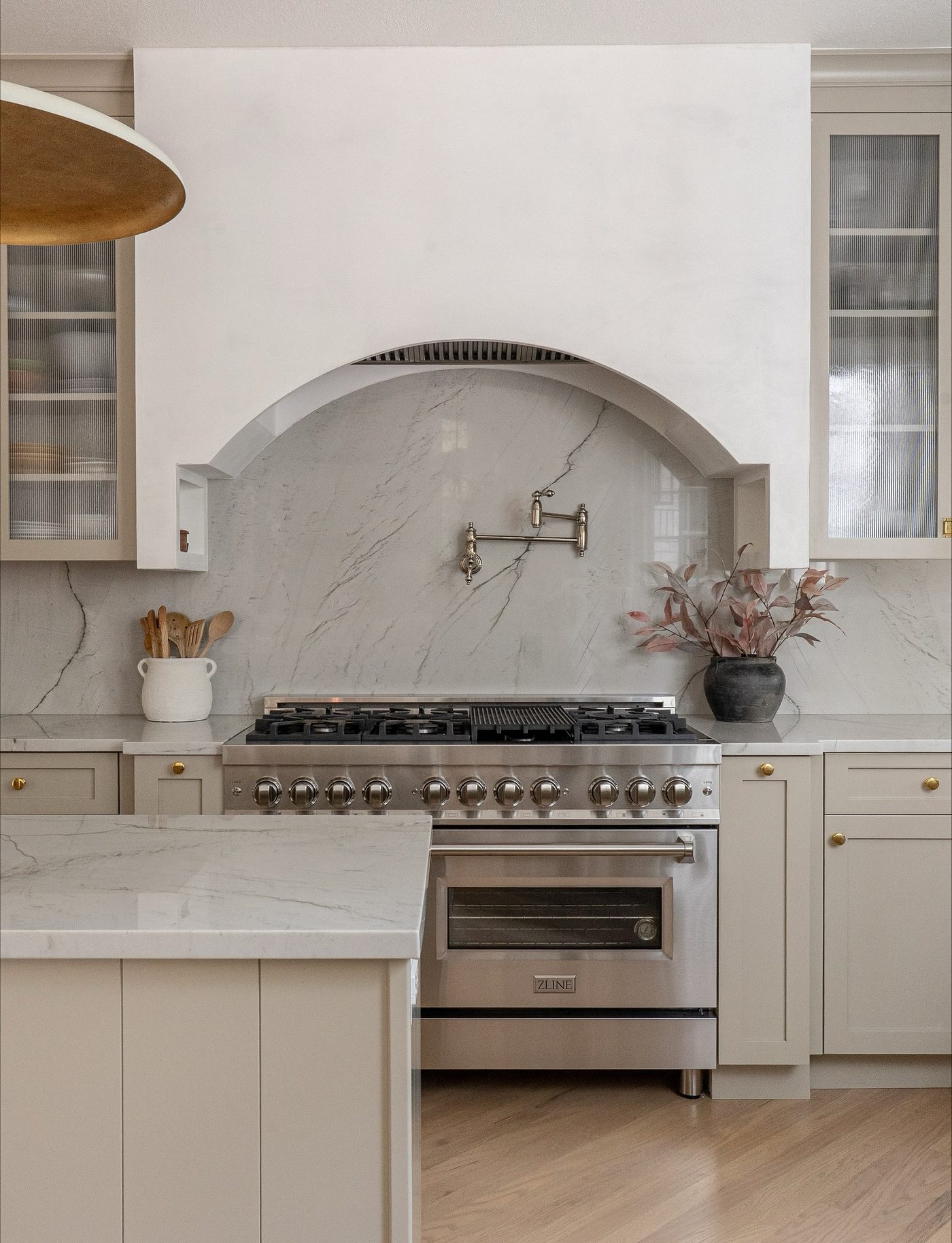 Arched range alcove with pot filler kitchen remodel