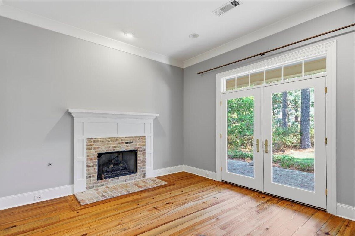 Formal living room with fireplace and French doors