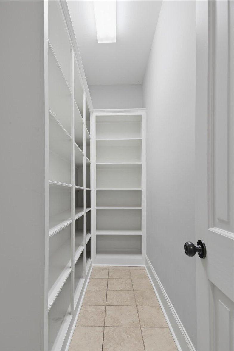 Walk-in pantry with built-in shelving