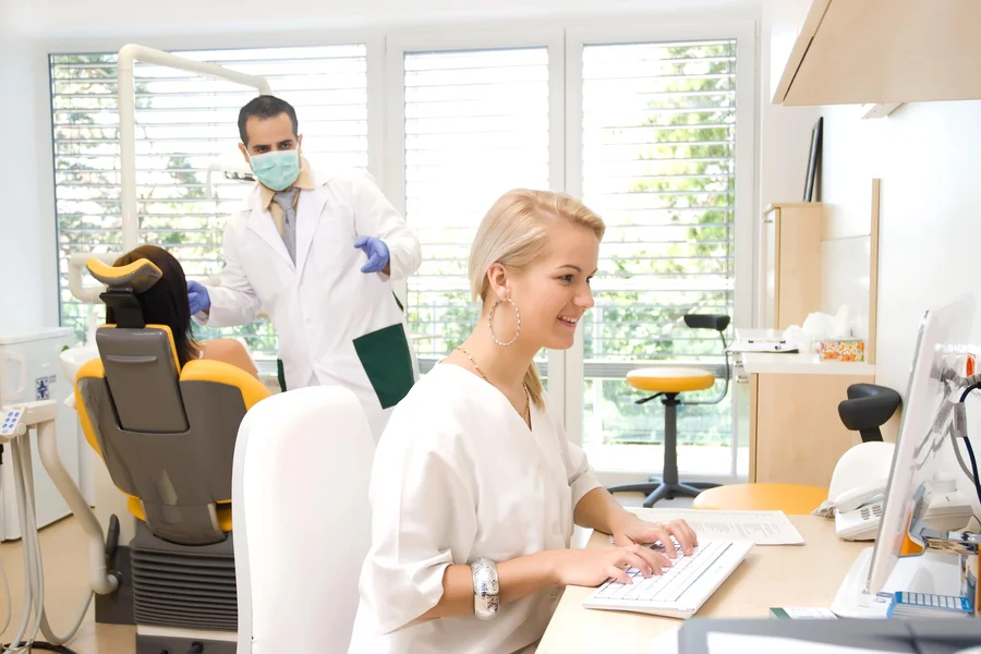 dentist-plainsboro-nj-staff-working-at-front-desk-and-treatment-room