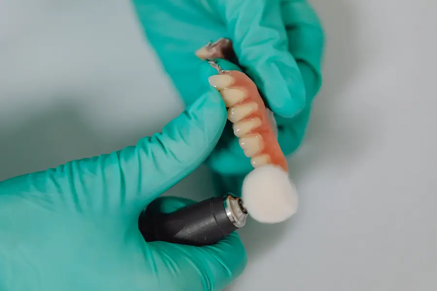 dental-implants-in-plainsboro-nj-dentist-polishing-a-partial-denture