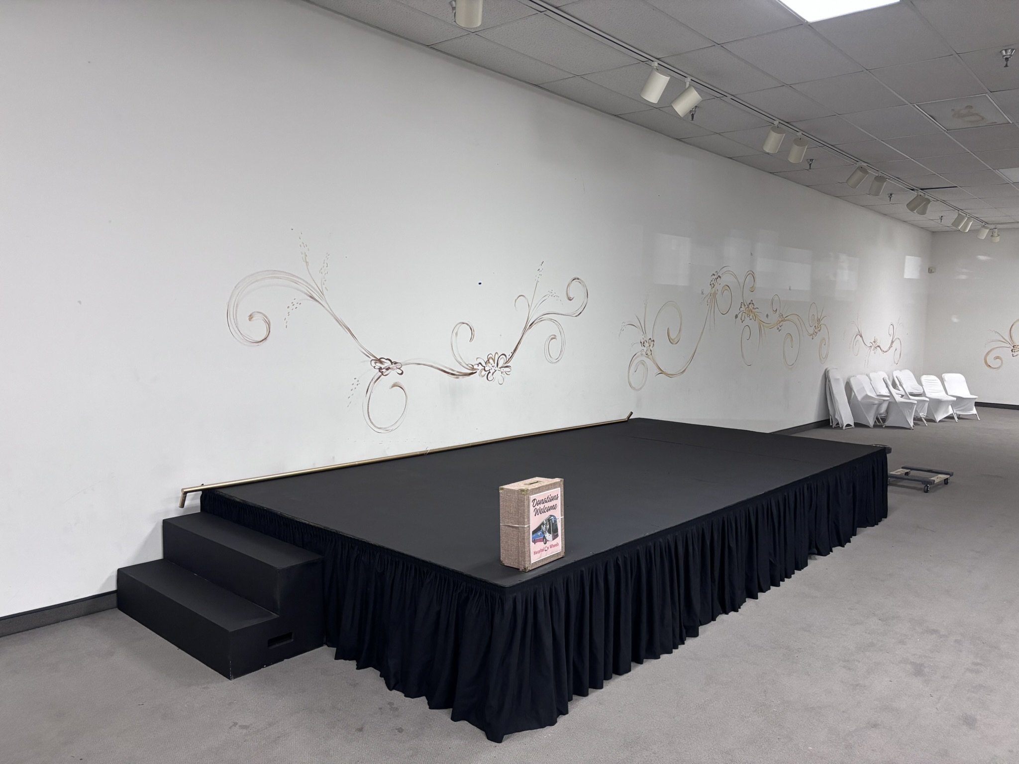 [background image] image of stage with seating (for an author & writer)