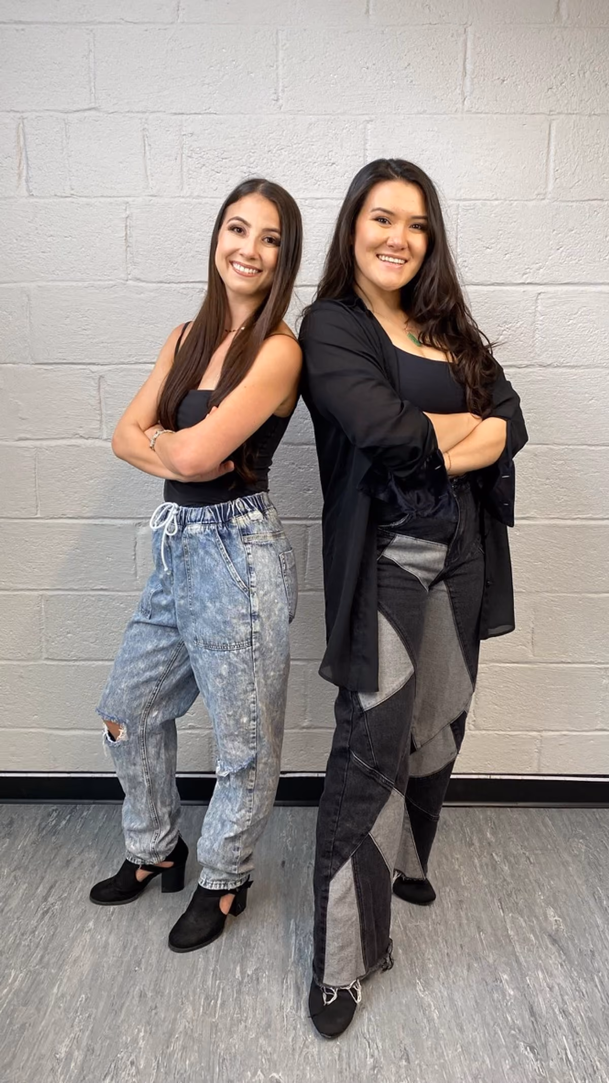 RDA co-owners Rachel and Emma standing back to back in the studio