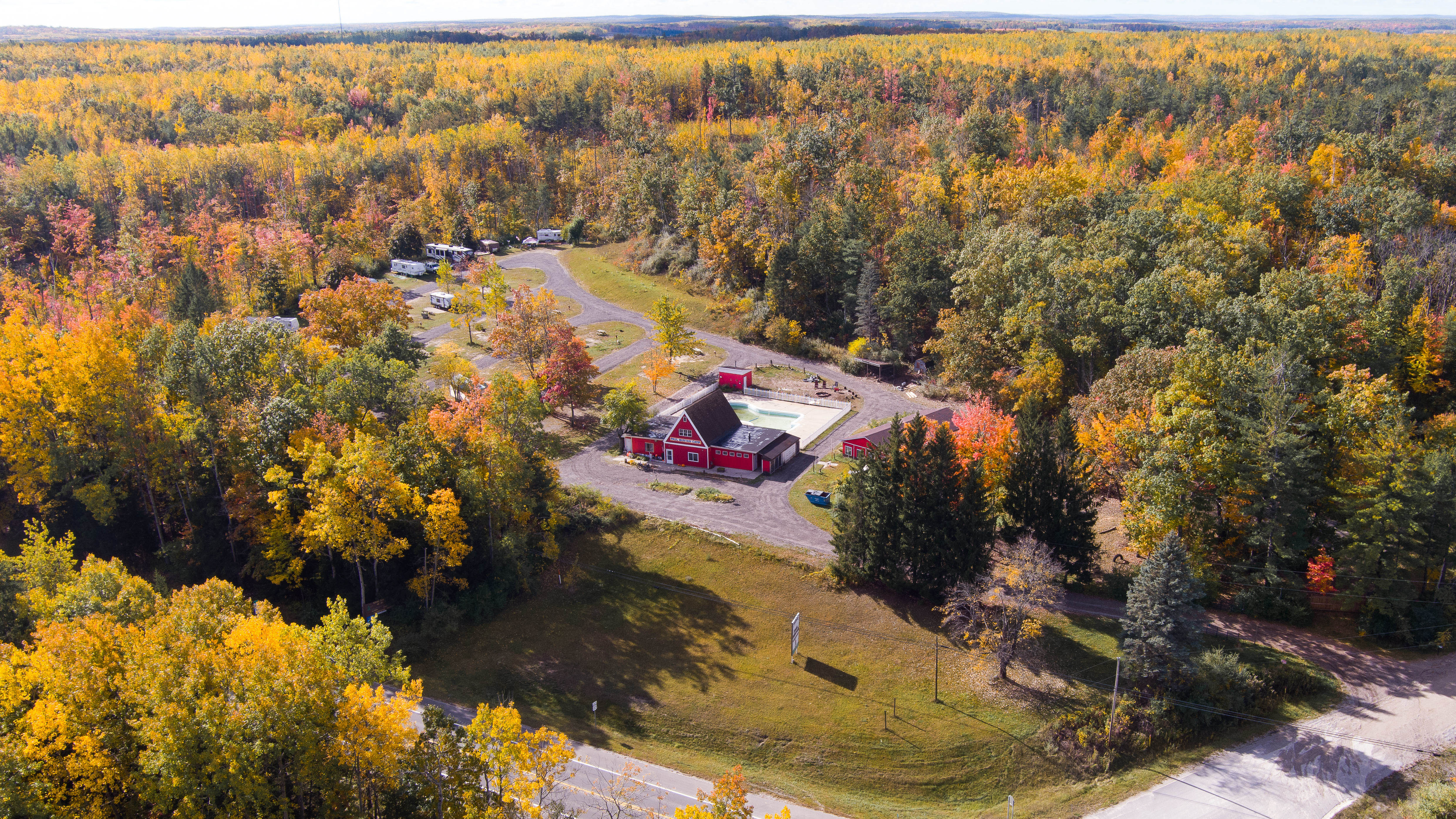 Aerial drone view of Paul Bunyan Campground surrounded by fall foliage