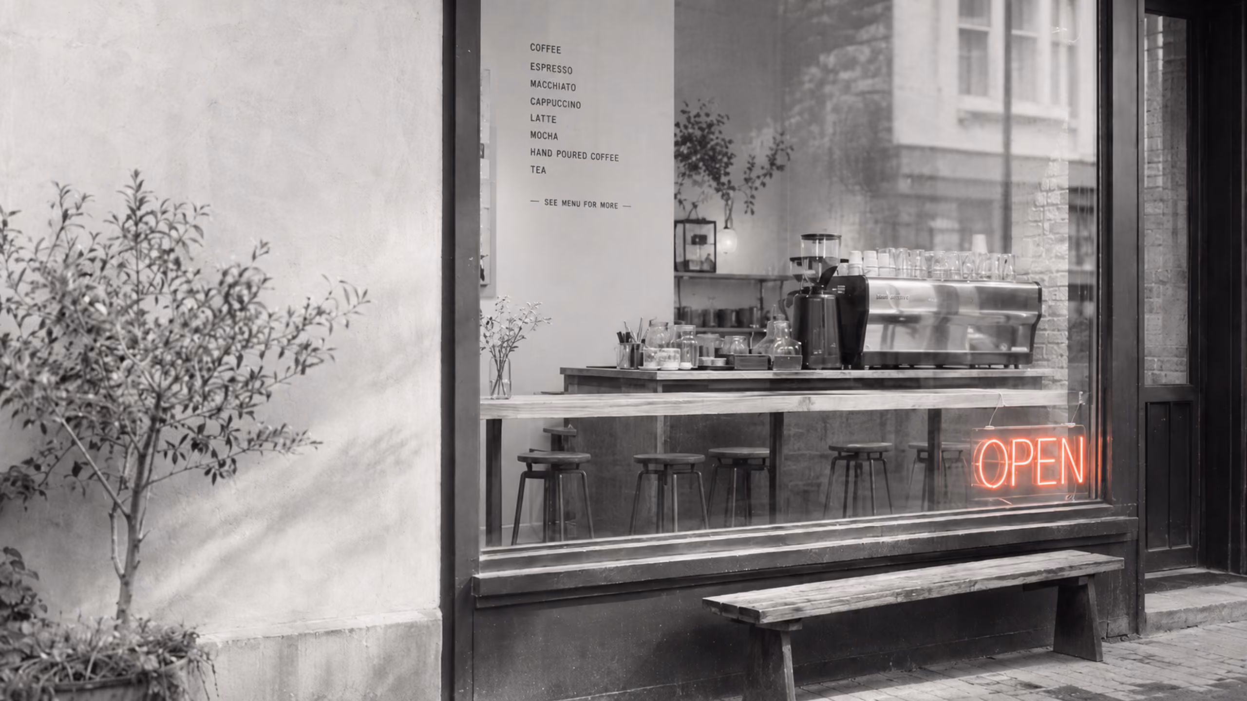 Independent neighborhood café with a glowing open sign in the window.