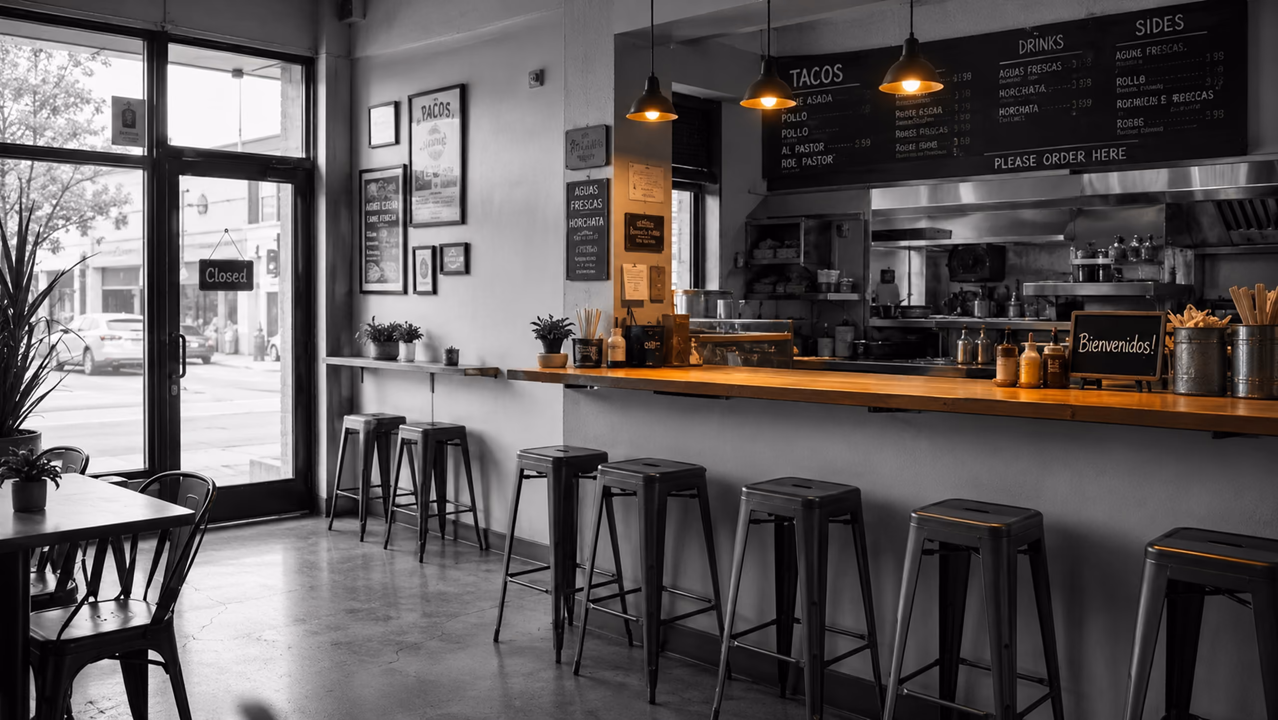 Small neighborhood restaurant with warm pendant lights over the service counter.