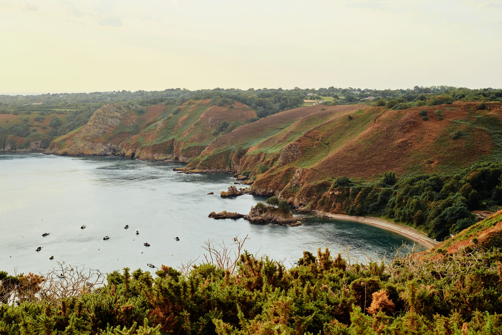 A runner on a coastal trail in Jersey