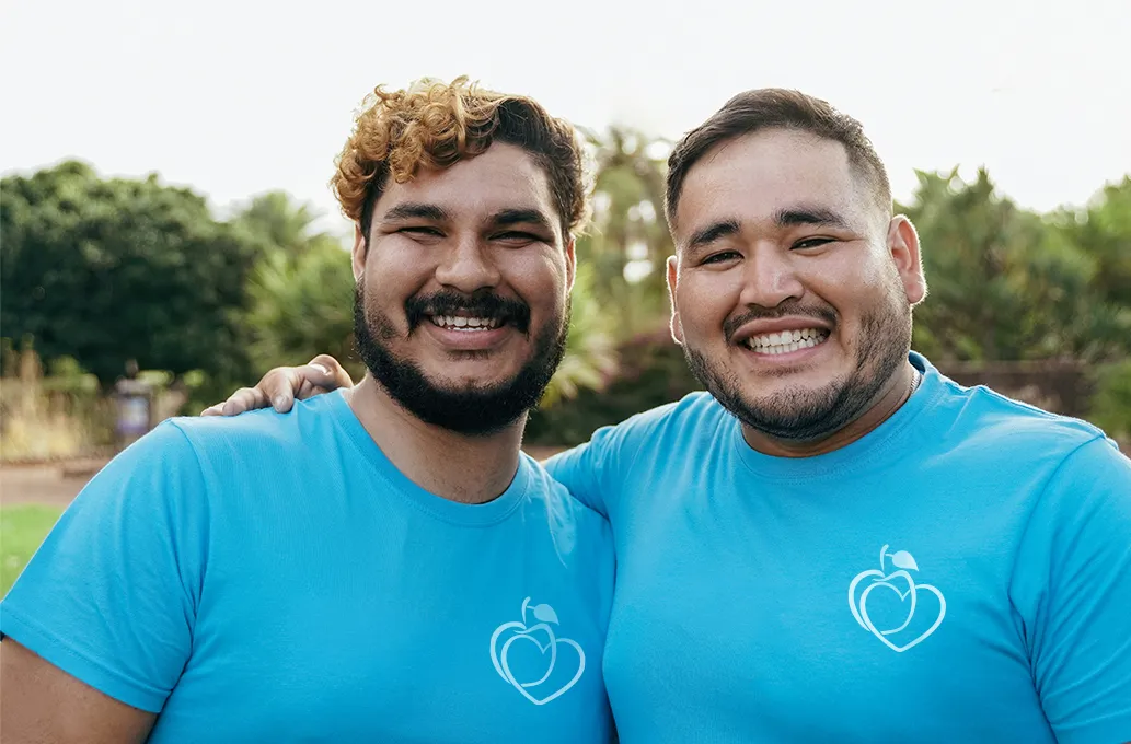 Two volunteers smiling together