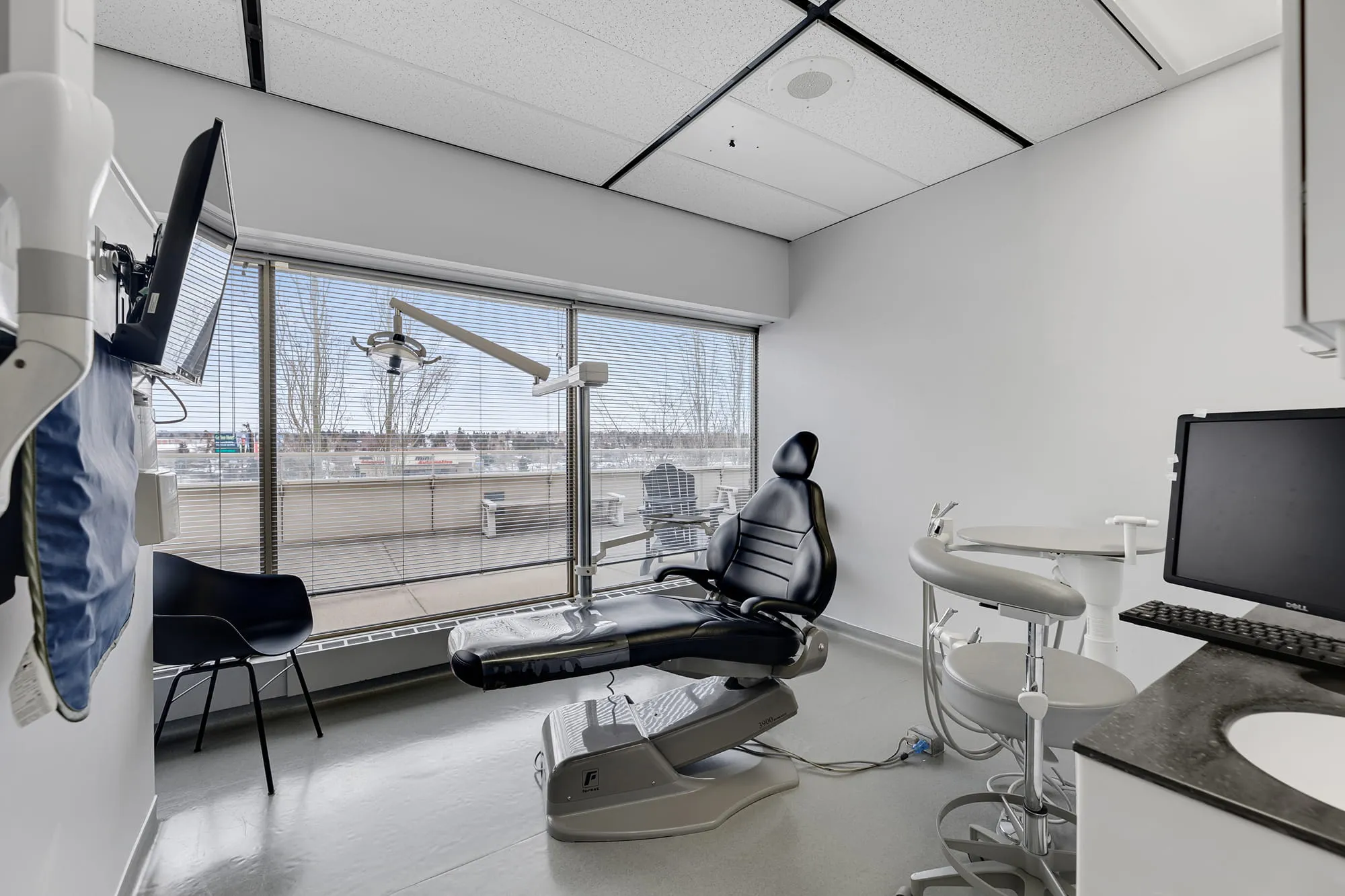 Bright treatment room with large windows at Macleod Trail Dental in Calgary