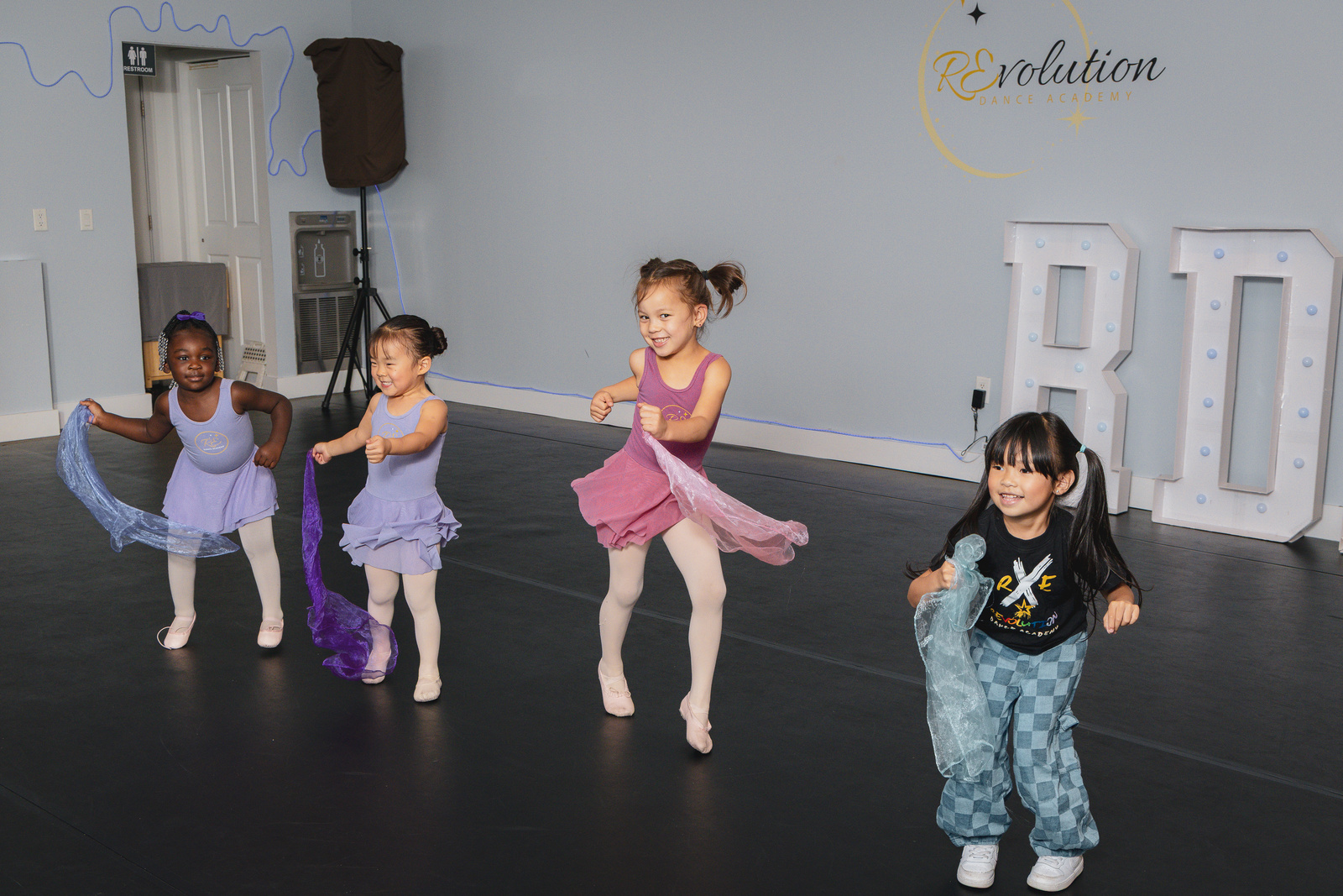 Preschool dancers dancing with scarves at Revolution Dance Academy