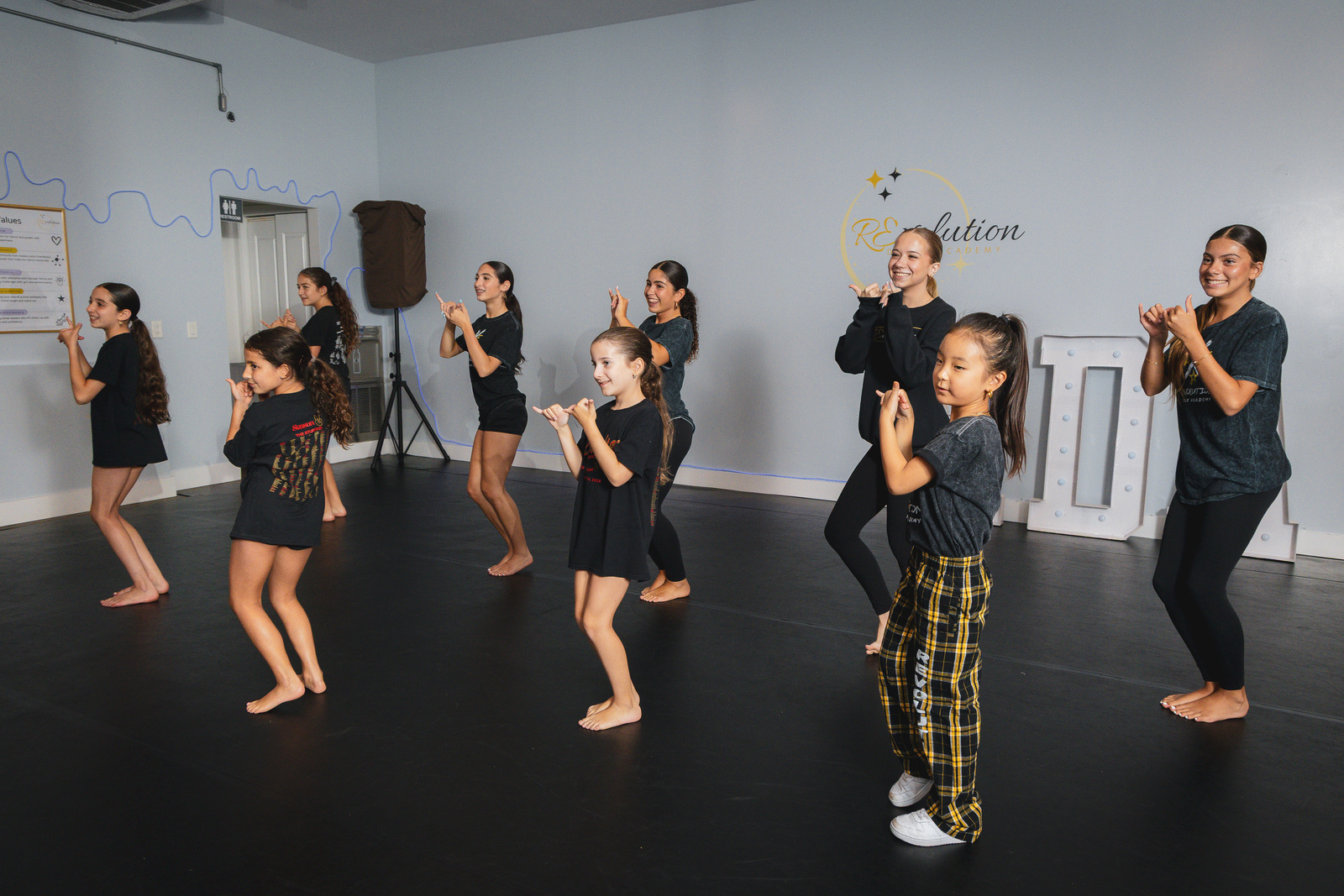 Dancers running through K-Pop choreography together at Revolution Dance Academy