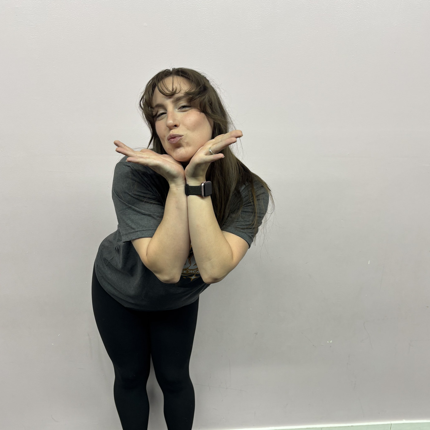 Kelly Bottini striking a playful pose in the Revolution Dance Academy studio