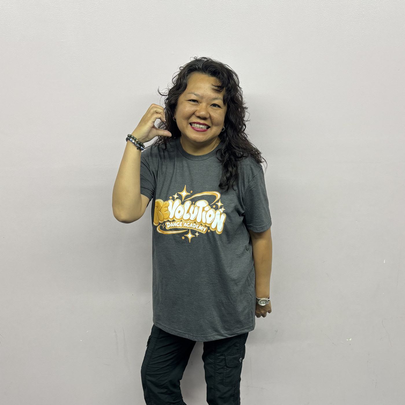 Betty Ku striking a playful pose in the Revolution Dance Academy studio
