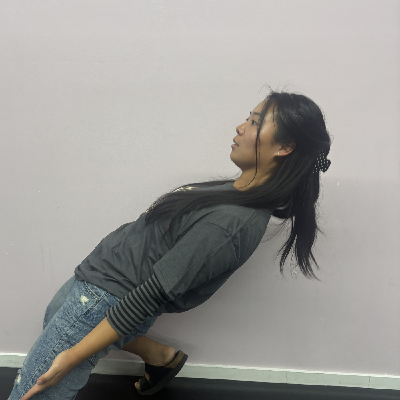Abigail Yi striking a playful pose in the Revolution Dance Academy studio