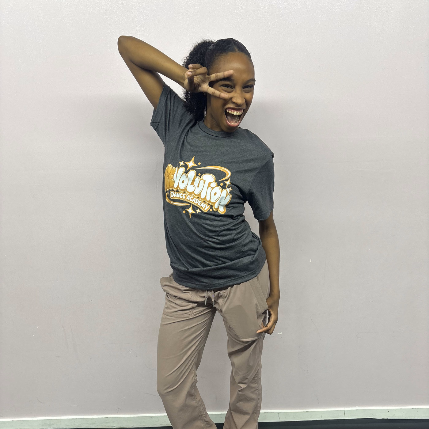 Skyler James striking a playful pose in the Revolution Dance Academy studio