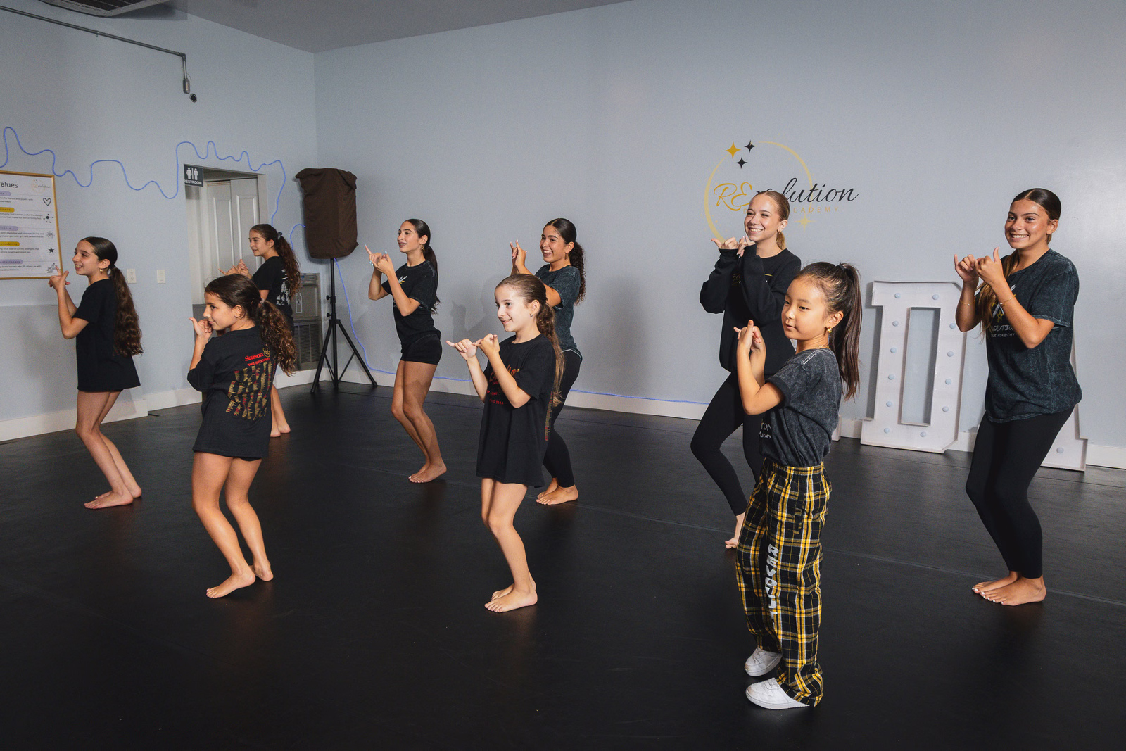 Dancers running through K-Pop choreography together at Revolution Dance Academy