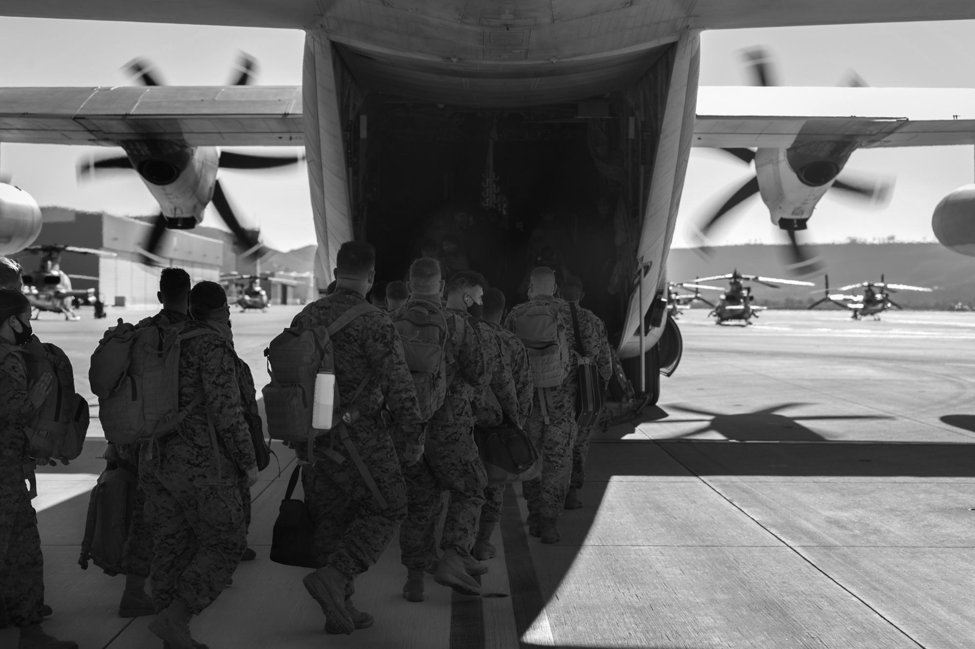 Troops boarding a military transport aircraft
