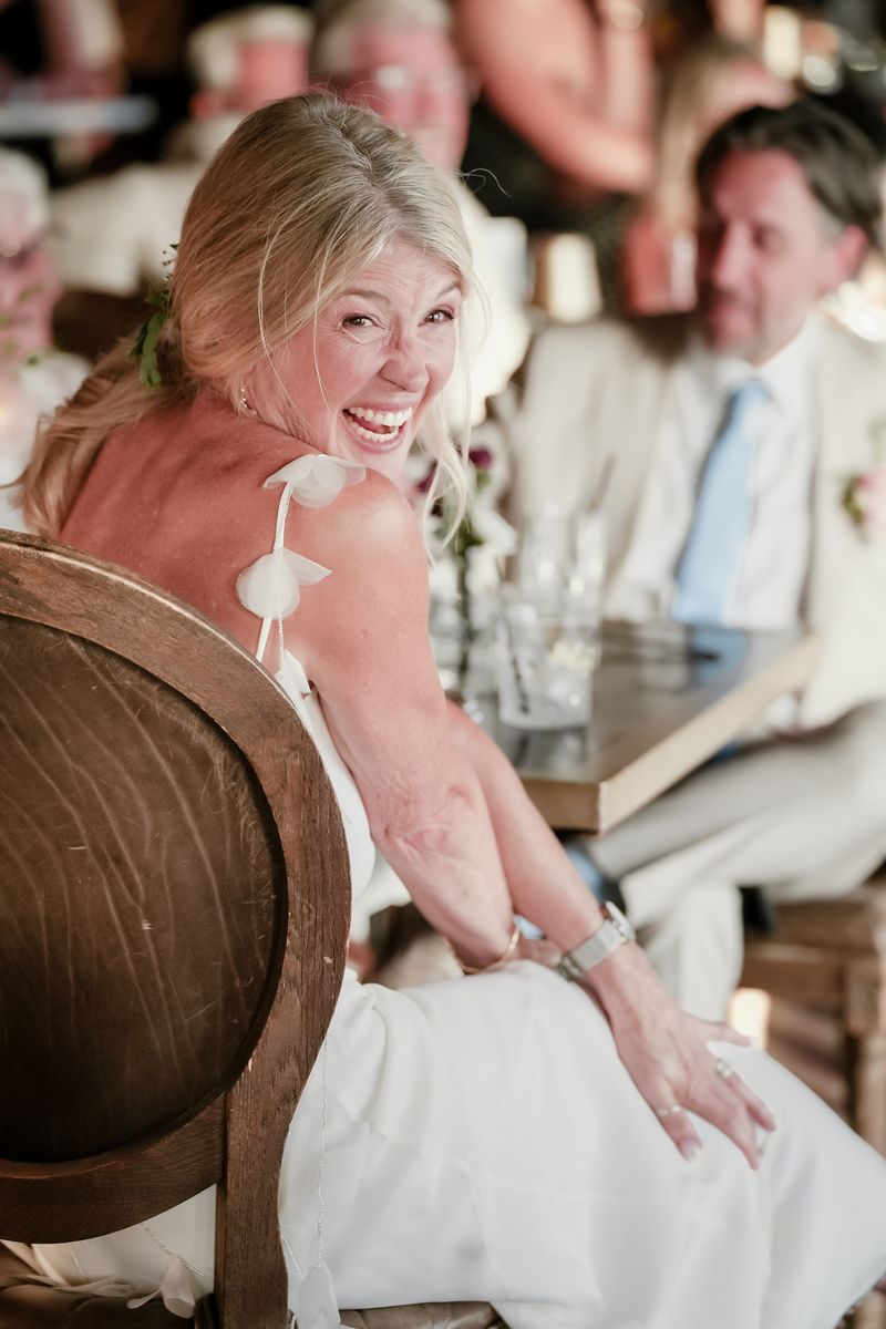 Guests laughing during a wedding celebration