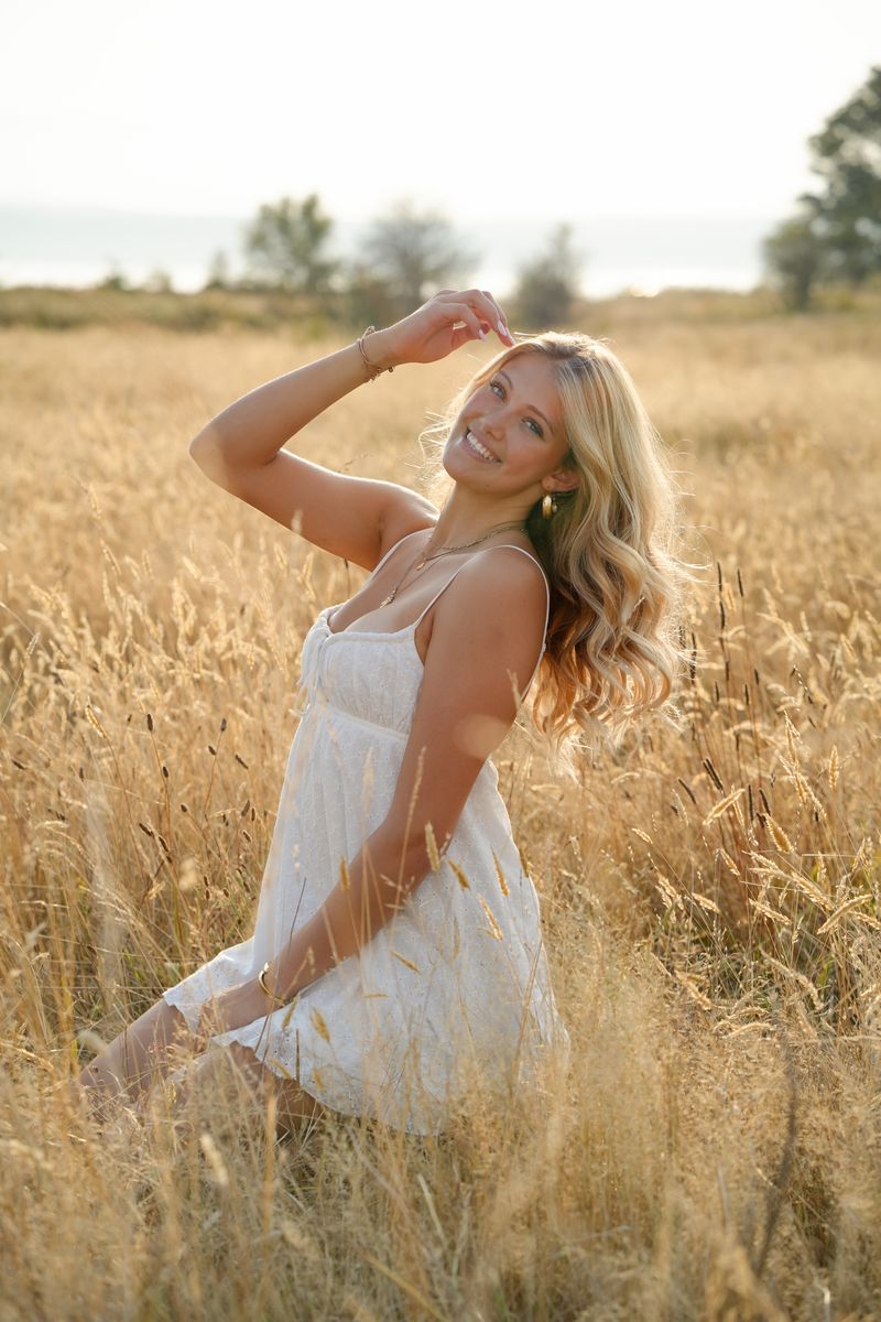 Maya in a golden field, photographed by Kelly Goto