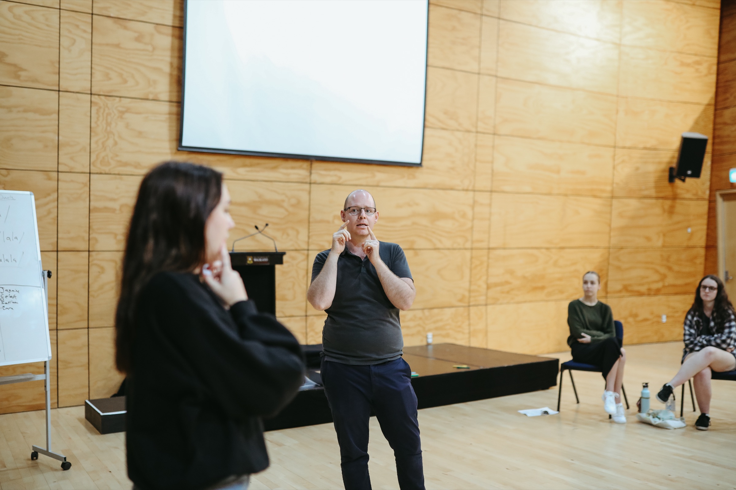 Scot Hall coaching a singer during a musical theatre voice class