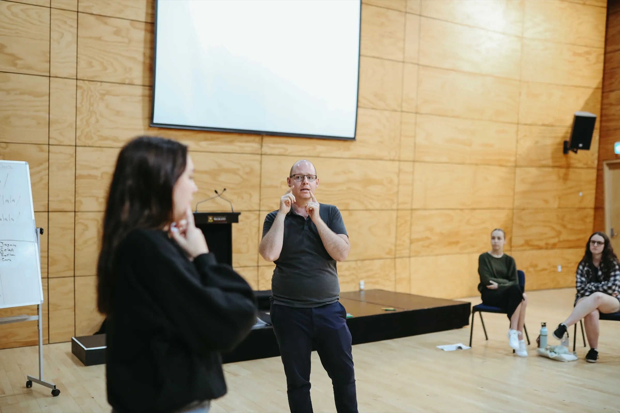 Scot Hall coaching a singer during a musical theatre voice class